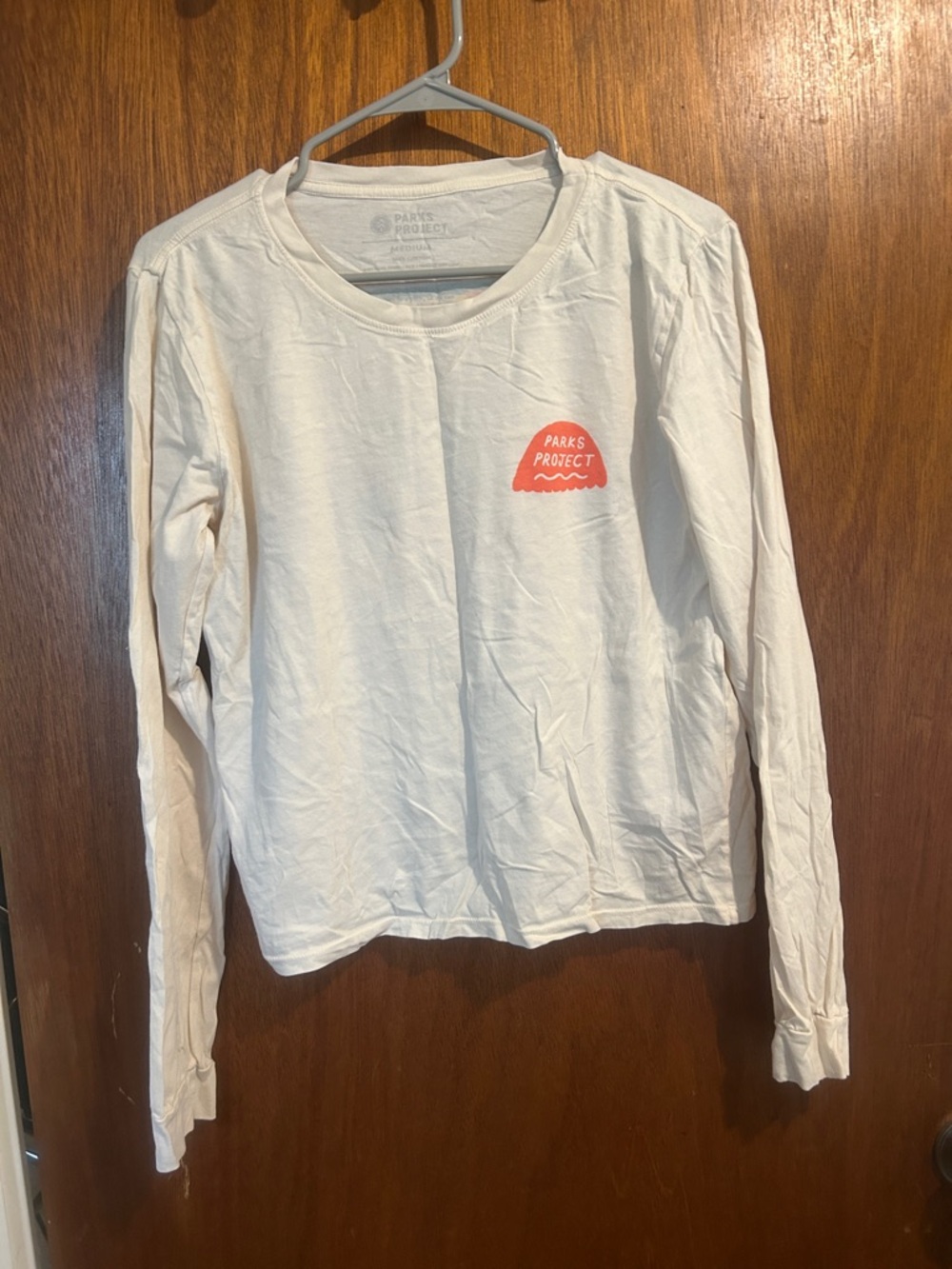 Parks Project Women's Long Sleeve Tee in Cream with Coral Logo